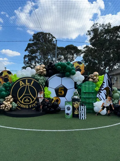 Another shot of the impressive football stage, showing the scale of the balloon decorations and custom props.