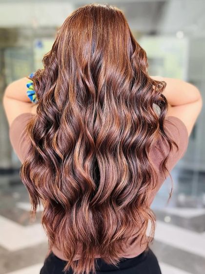 A close-up of our hazelnut hues, highlighting the rich, multi-dimensional tones and the healthy condition of the hair post-coloring.