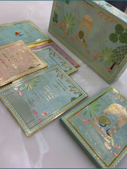 Another angle of our pastel green wedding invitation suite, showing the beautiful coordination between the outer box and the event cards.