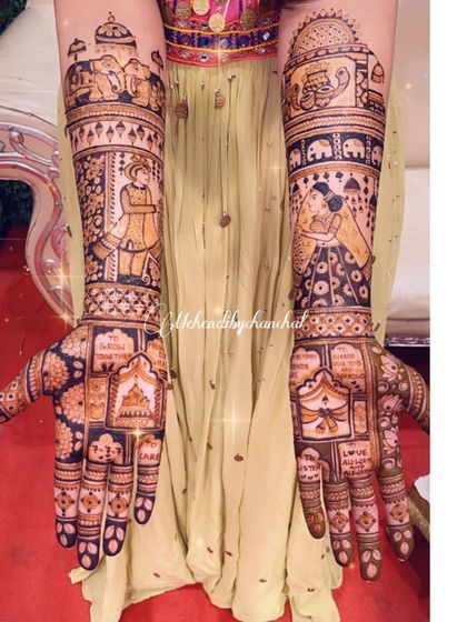 A beautiful example of a full story mehendi, with bride and groom portraits, wedding vows, and traditional motifs covering both arms.