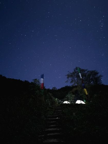 A magical night shot of the campsite under a starry sky, showing the clear heavens you can witness away from city lights.