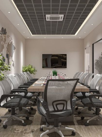 A conference room designed for productivity, featuring ample greenery, a large meeting table, and a world map accent on the wall.