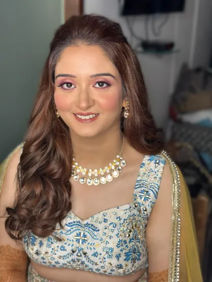 Priyanka's sangeet look was so fun to create. The pop of pink on the eyes added a playful touch to her blue and white printed lehenga.