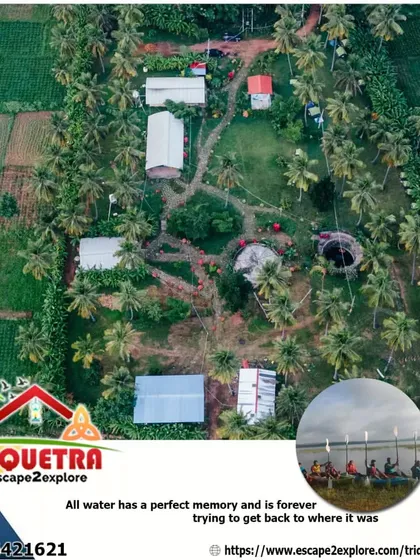 An aerial view of our complete property, showcasing the different buildings, green fields, and the nearby lake.