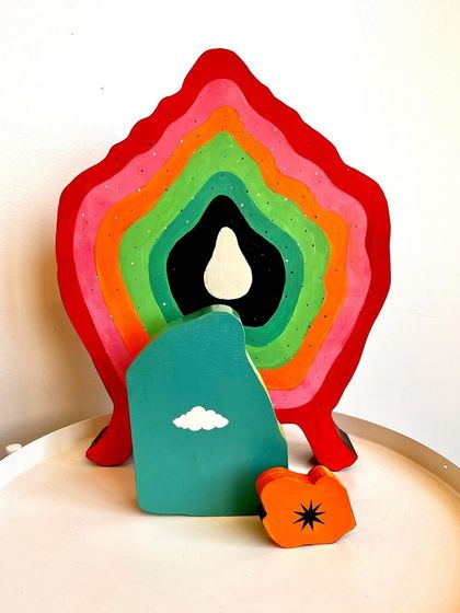 The back of the 'Safe Spaces' sculpture, which is also painted with a colorful, abstract design.