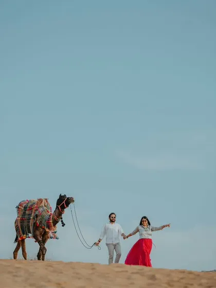 A pre-wedding adventure in the Pushkar desert with a decorated camel. We love incorporating local elements into our destination shoots to create a unique and authentic story.