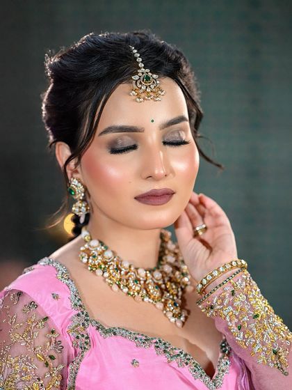 A close-up of the half-saree look with eyes closed, focusing on the soft smokey eye and glowing skin.