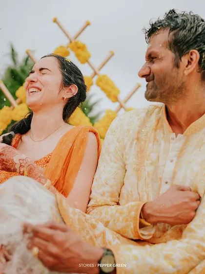 A moment of pure laughter from Eli during her Haldi ceremony. These uninhibited expressions of joy are what bring a wedding film to life.