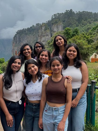 A group of friends enjoying the view from Pillar Rocks, one of the must-visit spots on our Kodaikanal itinerary.