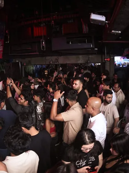 A wide shot of the dance floor, showing a full house from wall to wall.