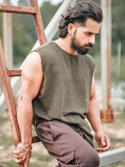 A series of portraits of actor Pruthvi Ambaar on location. These shots showcase a rugged, casual look against natural and industrial backdrops, highlighting his versatility.