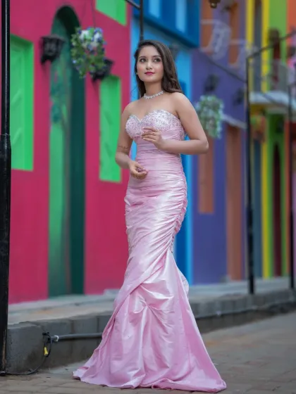 A glamorous evening gown look. The makeup is sophisticated and elegant, with a focus on sculpted features and a classic hairstyle.