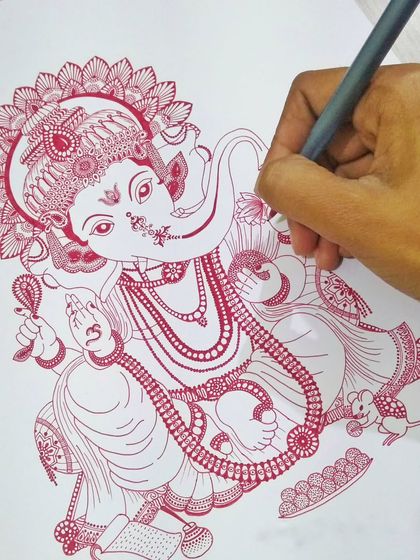 A work in progress shot of a highly detailed Ganesha drawing in red ink. This shows the intricate line work that goes into my traditional-style pieces before any paint is applied.