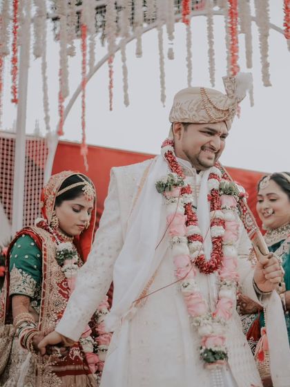 The couple walks together during the pheras, a candid moment filled with smiles and a sense of partnership.