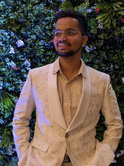Look at the smile on our happy client. This off-white, self-patterned tuxedo blazer is perfect for evening parties and special events. It has a classic shawl lapel that gives a sophisticated touch for any men's party wear look.