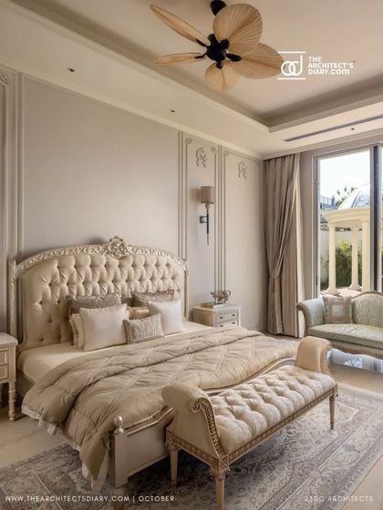 A closer look at the master bedroom in The Ivory Royale, featured in The Architect's Diary. The tufted headboard, classic bench, and ornate furniture are all part of a cohesive design that radiates regal charm and comfort.