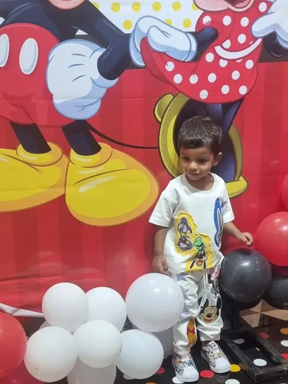 A little guest enjoying our Mickey Mouse themed party setup. I can arrange decorations for any character your child loves to make their day special.