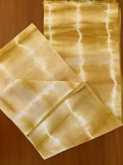 Two meters of cotton voile, naturally dyed with onion skins, now sold. The soft yellow and white striped pattern is subtle and elegant. I'm always happy to take custom orders!