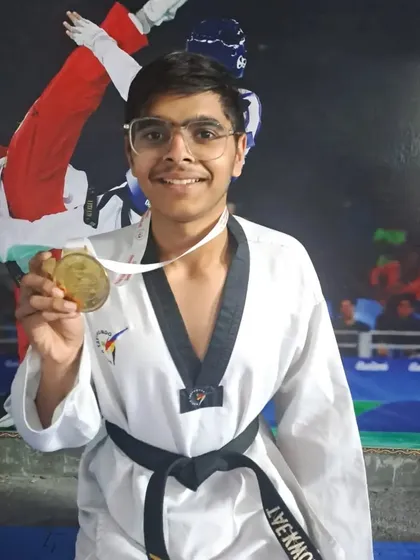 A close-up of Anshul Tanwar with his gold medal from the 38th Delhi State Cadet Taekwondo Championship.