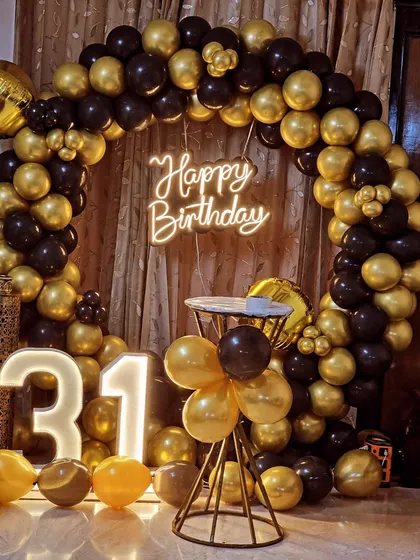 The full black and gold ring decoration for a 31st birthday party.