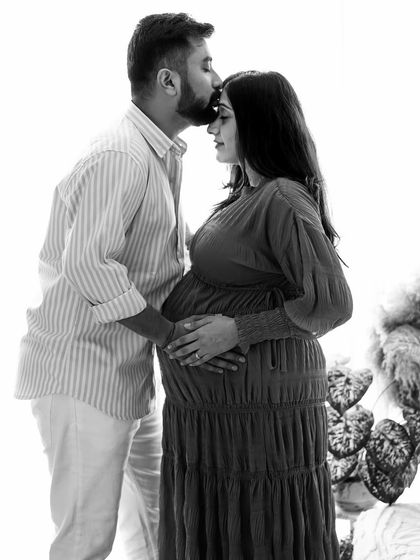 The same tender pose as in other shots, but transformed by black and white into a classic, high-contrast work of art.