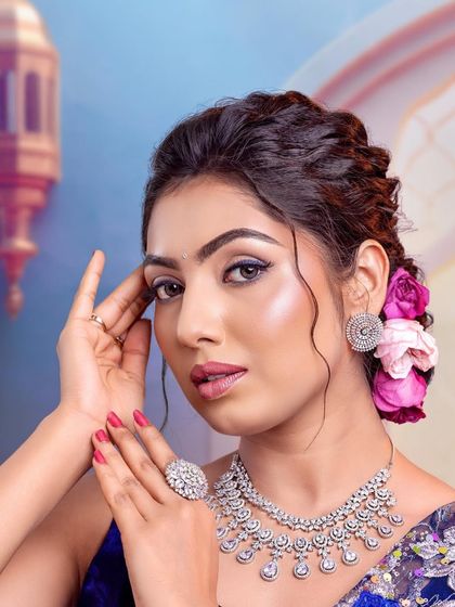 A close-up of the beautiful eye makeup, featuring a pop of blue liner for a modern twist.