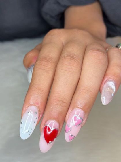 The full set of the cat eye and chrome heart nails, a perfect Valentine's look.