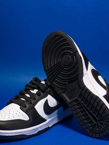 This shot of the 'Panda' Dunk highlights the classic outsole tread and the clean separation of the black and white panels.