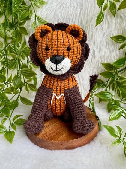 A unique lion created from a child's drawing! I love bringing your creative ideas to life. This striped lion with the initial 'M' is a truly one-of-a-kind creation.