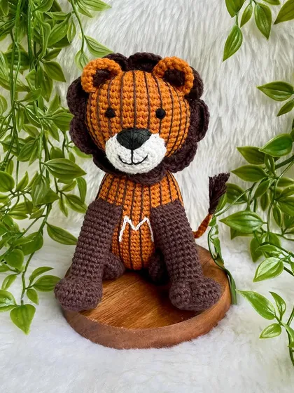 A unique lion created from a child's drawing! I love bringing your creative ideas to life. This striped lion with the initial 'M' is a truly one-of-a-kind creation.