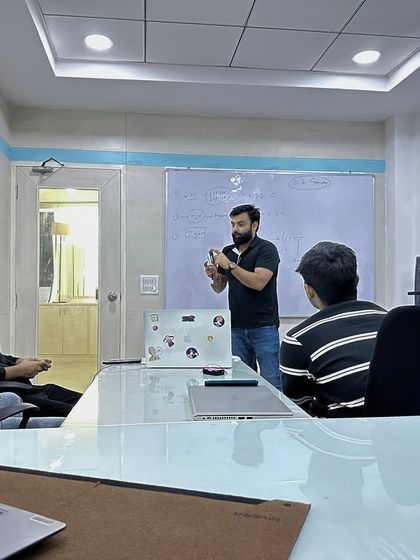 Here I am with my team, making devices talk to clouds. This is where the magic happens, brainstorming and developing the next generation of IoT solutions.