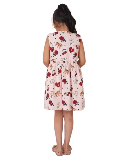 The back view of a printed pink dress, showing the pattern and cut clearly.