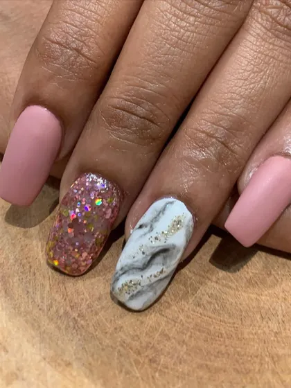 Another look at this mixed-finish manicure, showing how different textures and designs can work together to create a cohesive and stylish set.