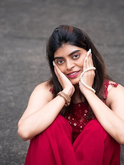 An expressive outdoor portrait. The low angle and seated pose create an intimate and engaging photograph.