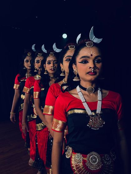 Our dancers in a striking pose for their "Shivashtakam" performance. The crescent moon headpieces and intense expressions set a powerful tone.