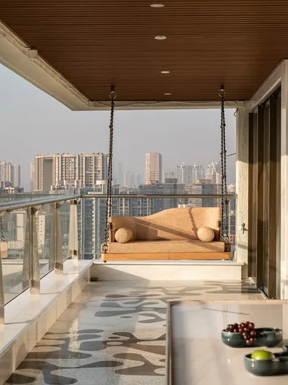 For this sea-facing Mumbai terrace, we designed a serene escape with a custom daybed and a sleek, reversible swing. The furniture is designed to be both durable for the outdoors and elegant enough to complement the stunning city views, creating a perfect spot for lazy afternoons or lively evenings.