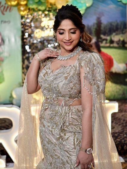 A candid shot of our client enjoying her event in our rental gown. Our outfits are designed to be both beautiful and comfortable.