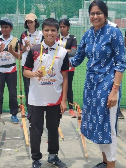 That proud moment when you receive your first archery medal. This is what it's all about, celebrating milestones and building confidence.