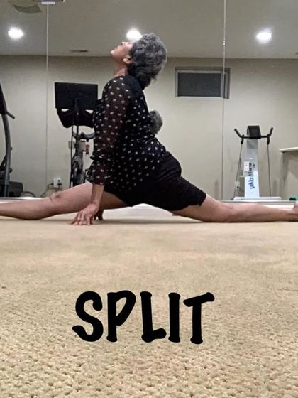A full split, or Hanumanasana, demonstrated in a home practice setting. This pose is a key part of my advanced flexibility and hip-opening sequences.