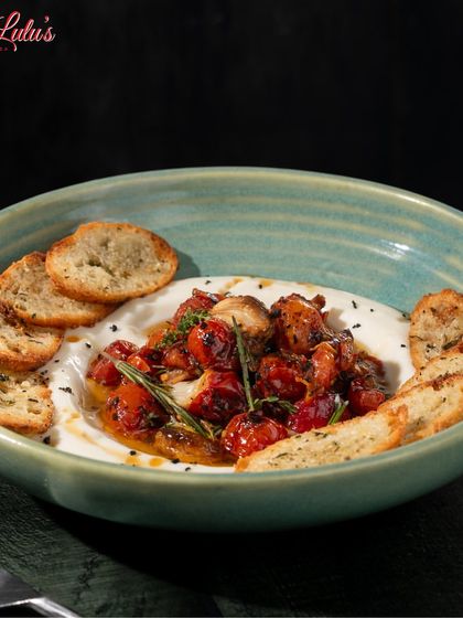 It’s a ‘whip up the warmth’ kind of day. My Whipped Ricotta Honey Toast features creamy ricotta mousse, hot honey, and confit cherry tomatoes on a baguette toast.