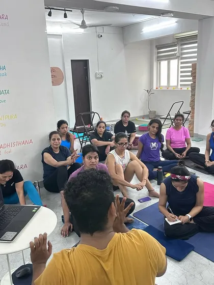 A moment from our back bending intensive, where I'm explaining the theory behind the practice. Understanding the 'why' is just as important as the 'how'.