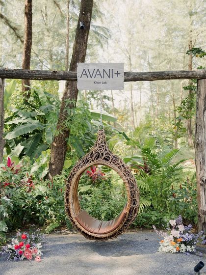 The serene and lush surroundings of Avani+ Khao Lak, a perfect venue for a destination wedding. A quiet swing offers a moment of peace amidst the grand celebrations.