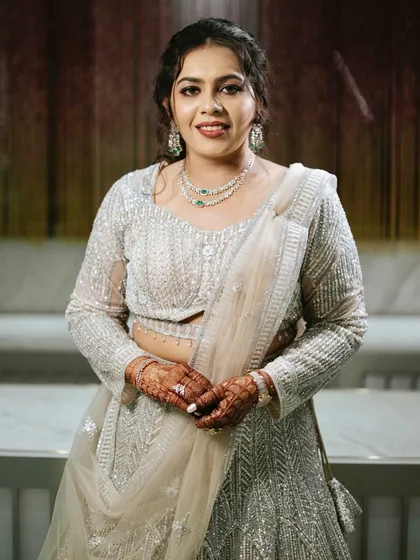 A dreamy reception look. Soft glam with shimmer eyes and a flawless base to complement her beautiful silver lehenga.