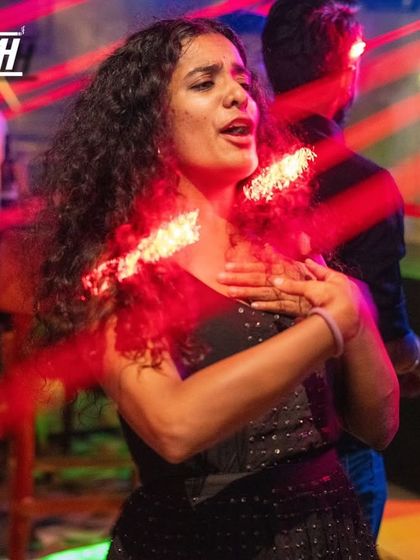 Caught in a laser-lit moment at Babylonia. The lighting and music work together to create an immersive party experience.