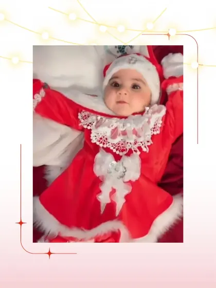 A perfect little Santa baby. This red velvet dress with white fur and lace trim is a classic and adorable choice for a baby's first Christmas.