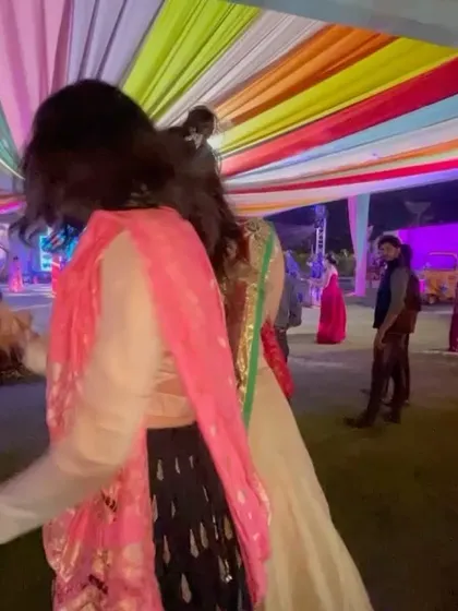A shot of the colorful decor and guests dancing at the outdoor Dandiya Night at Prestige Drive Park.