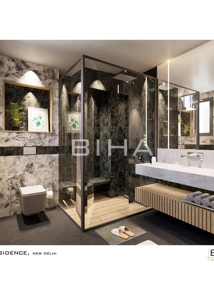 For this New Delhi residence, we designed a washroom with a dramatic interplay of textures. The shower area is clad in dark, heavily veined marble, creating a stunning focal point, while the floating wooden vanity adds a touch of organic warmth.
