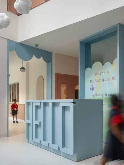 The first impression matters. We designed the nursery reception desk with a playful, three-dimensional "HELLO" to create a warm and immediate welcome for children and parents alike.