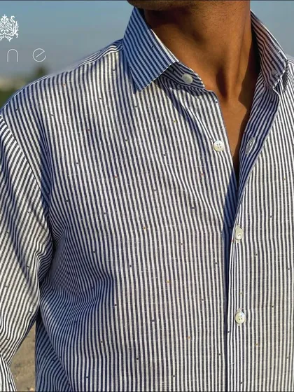 A classic striped shirt made from the finest quality fabric. The fit is tailored to be comfortable yet sharp, perfect for any occasion.