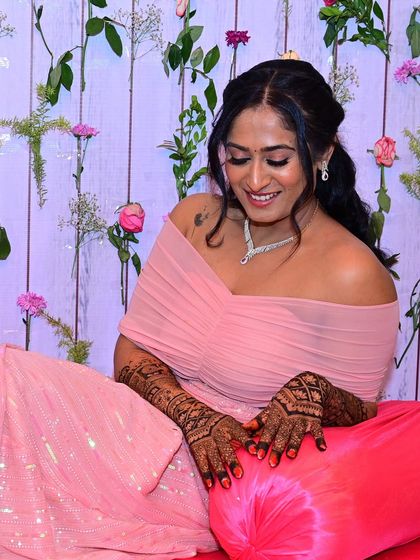 A sweet, candid moment of Shilpa admiring her intricate mehendi.